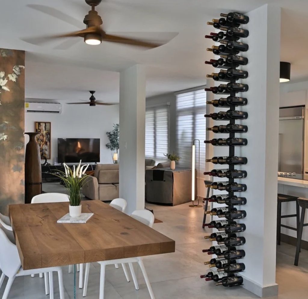 Modern wine walls Puerto Rico: vertical bottle display in a residence.