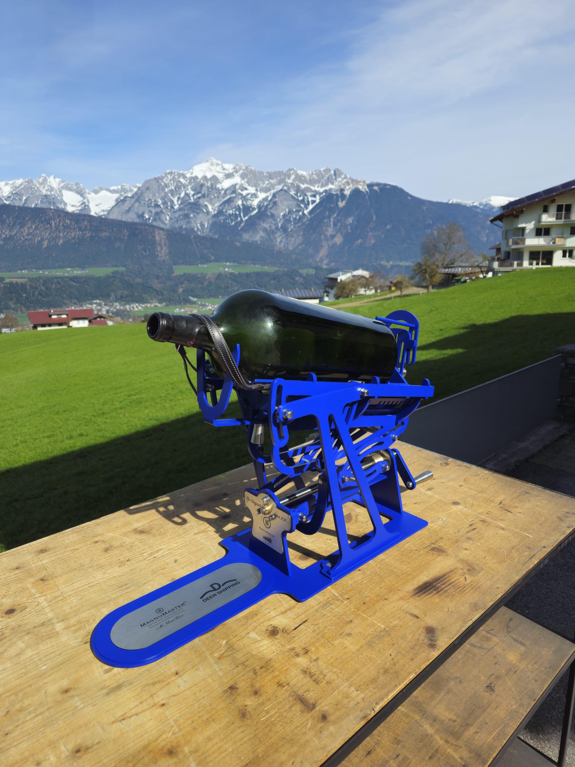 Blue MagnuMaster cradle holding a large-format wine bottle